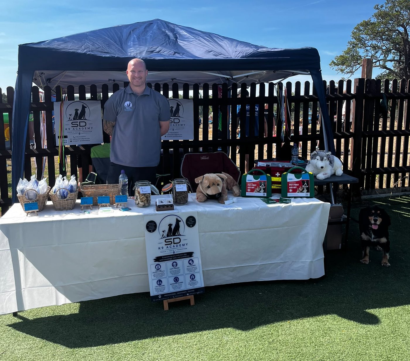 Steve from SDK9 Academy with pet first aid kits at a community event in Surrey